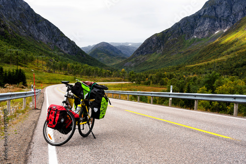 LOFOTEN, NORWAY - SEPTEMBER 10, 2019:  Heavy loaded bicycle with panniers and bags in Lofoten, Norway - popular tourist and cyclist destination in Scandinavia