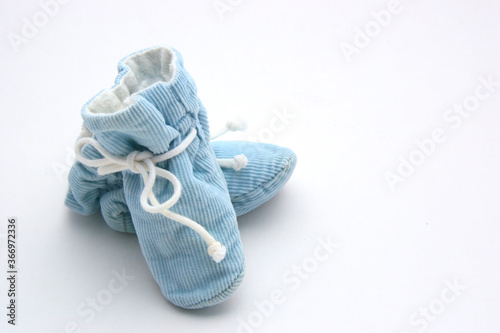 Blue Baby Booties with White Background Copy Space. Can be used for Gender Reveal Party, Baby Shower, Baby Boy Birthday, etc.