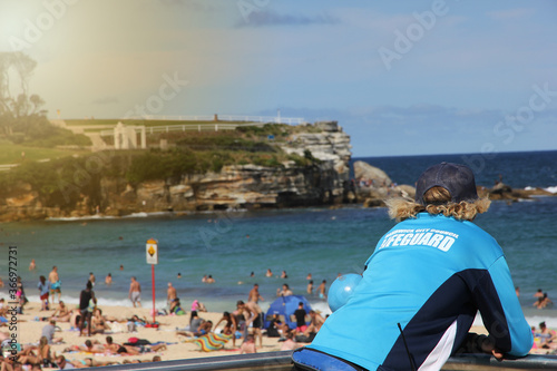 Photography A lifeguard watching over the world famous Bondi Beach, which is very crowded