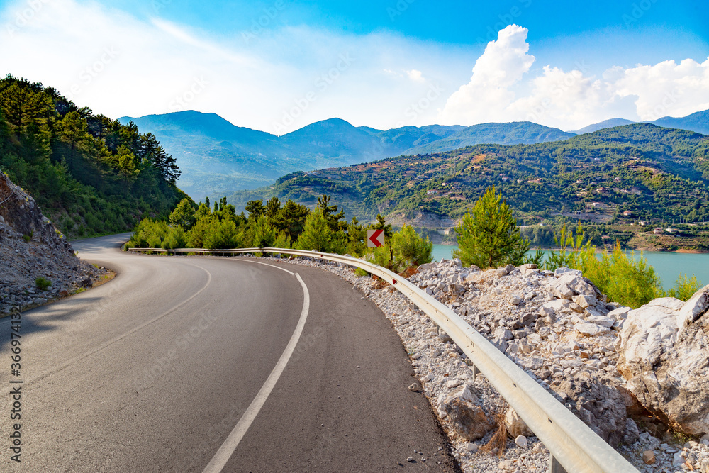 Driving through the mountain highway near a beautiful Green Canyon at Antalya province, Turkey.