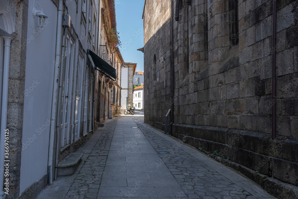 Alley With Cobblestones and Wall Of Ancient Church, Braga, Portugal