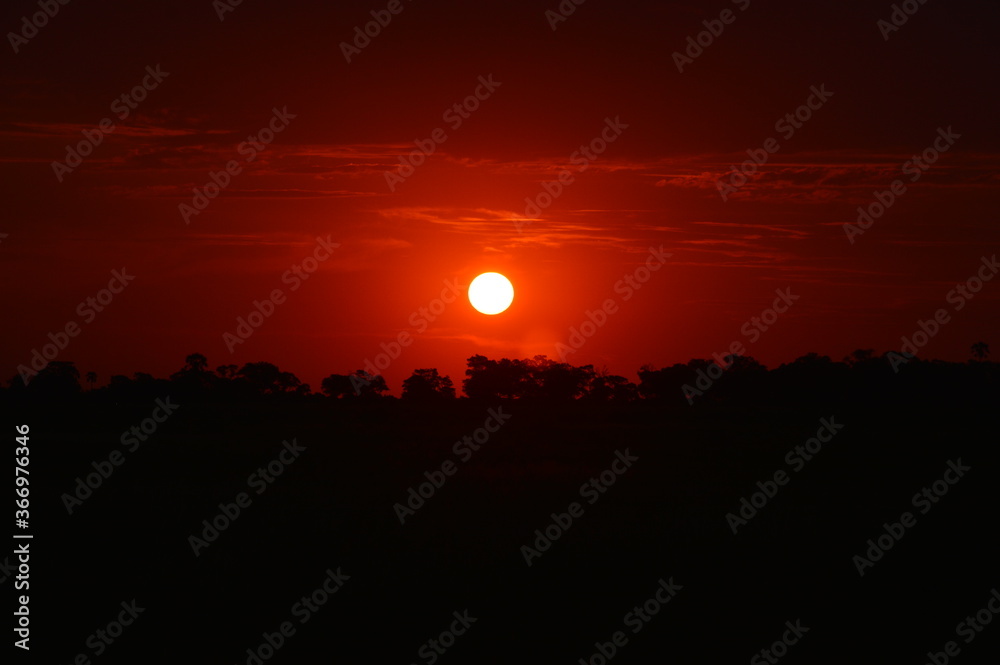 African sunset over the Okavango Delta in Botswana African sunset over the Okavango Delta in Botswana
