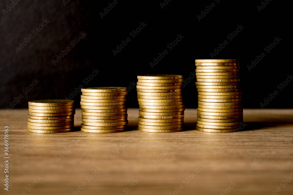 stacks of gold coins concept save money