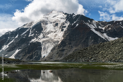 Glacier on a mountain peak. Mystical ghost gaze. Altai, Russia.