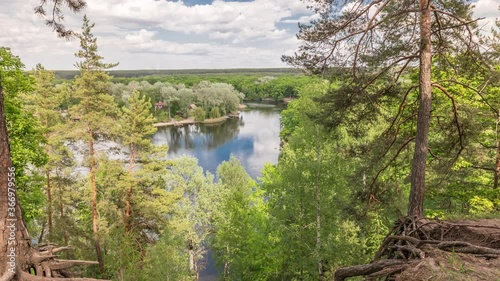 Aerial view on Severskij Donec river from Cossack Mountain timelapse in Kharkiv region, Ukraine. Tree roots and steep slope. Landscape panorama photo