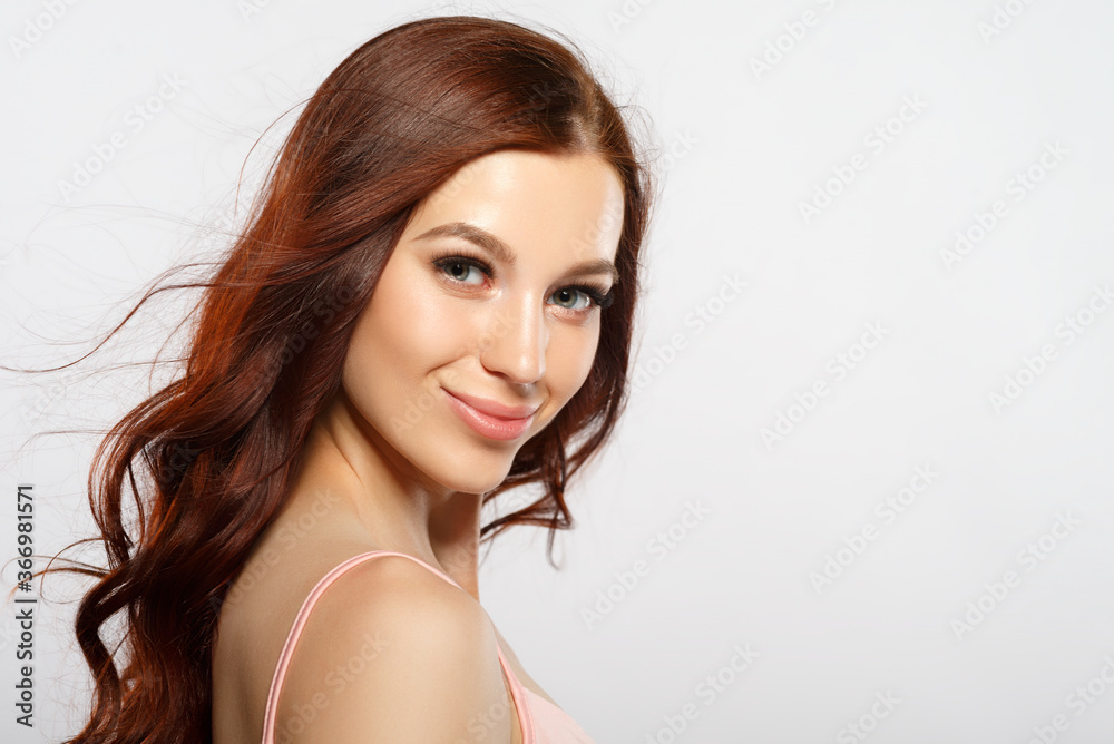 beauty portrait of a red-haired woman on a white background. beauty portrait of a red-haired woman on a white background.
