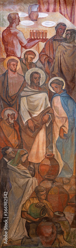 Photography BARCELONA, SPAIN - MARCH 3, 2020: The fresco of The miracle at the wedding at Cana in the chruch Iglesia de Belen by artists (Grupo Flama) from half of 20
