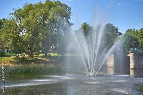 Fountain in the river in city center 
