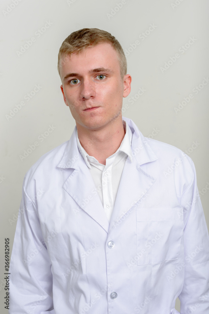 Portrait of young man doctor with blond hair Portrait of young man doctor with blond hair