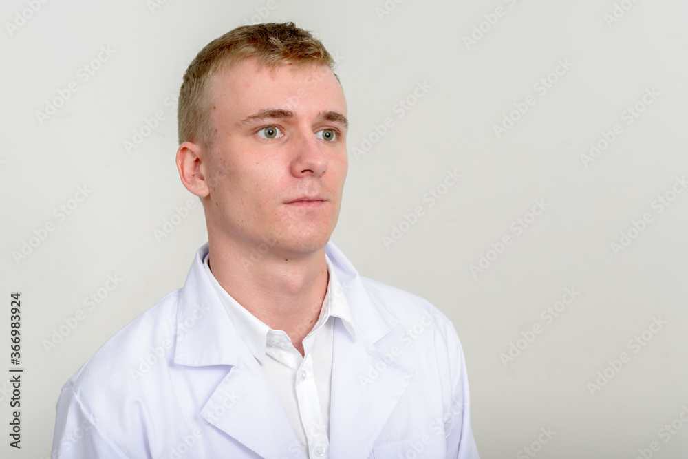 Portrait of young man doctor with blond hair Portrait of young man doctor with blond hair