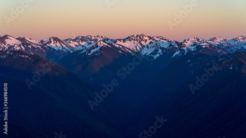 Sunset over Olympic National Park snow covered peaks photo