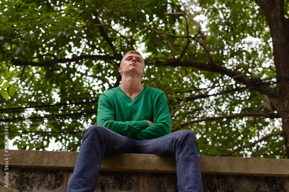 Portrait of young man with blond hair outdoors Portrait of young man with blond hair outdoors
