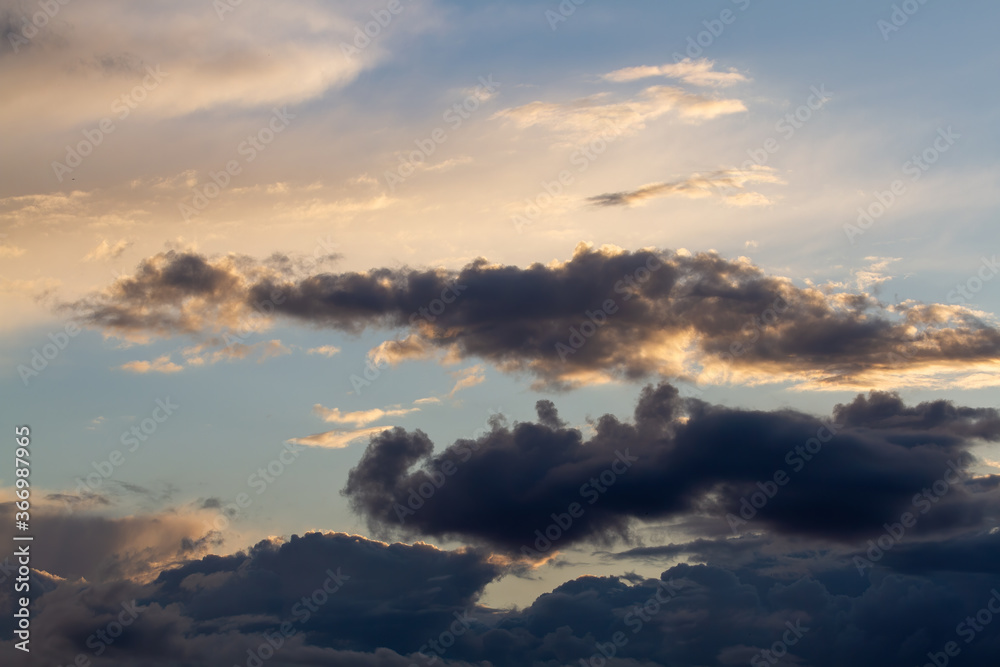Dark clouds. Blue sky. Beautiful natural background. Dark clouds. Blue sky. Beautiful natural background.