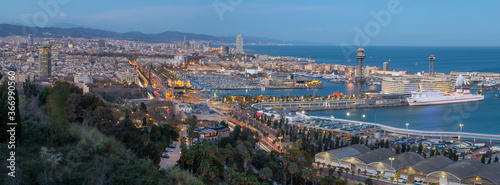 Barcelona - The panorama of the city with the harbor at the dusk.