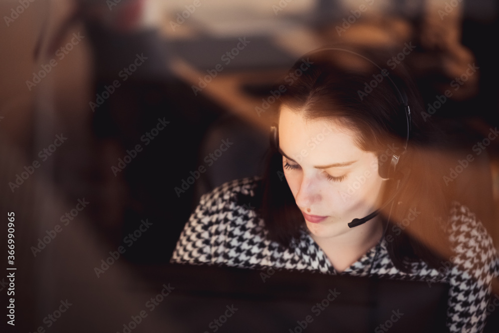 The programmer girl works at the computer The programmer girl works at the computer