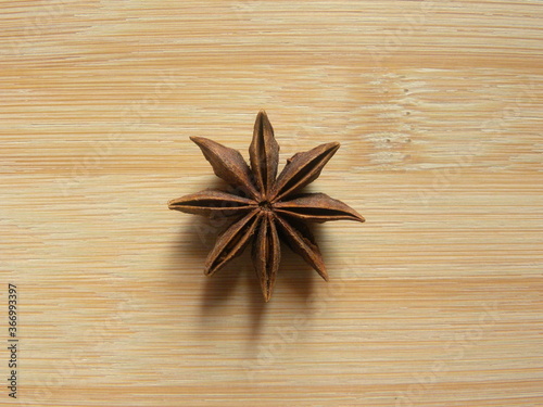 Brown color Star Anise fruit on wood background