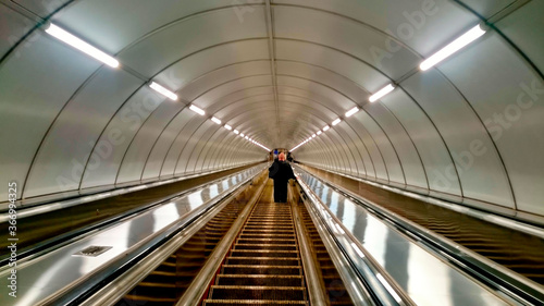 Escalator, moving ramp in subway.