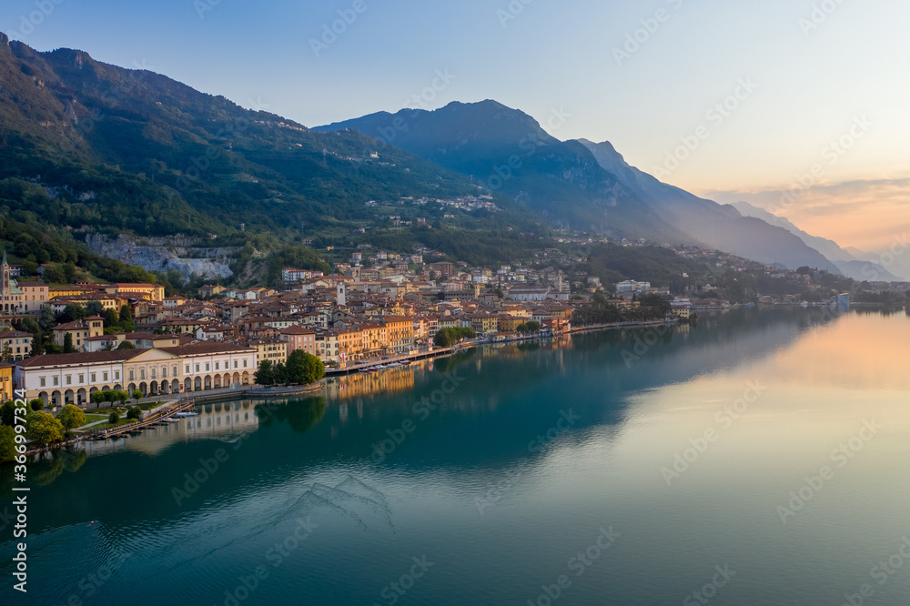 Aerial view of Lake Iseo at sunrise, on the left the city of lovere which runs along the lake,Bergamo Italy.