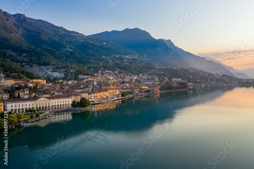 Aerial view of Lake Iseo at sunrise, on the left the city of lovere which runs along the lake,Bergamo Italy.