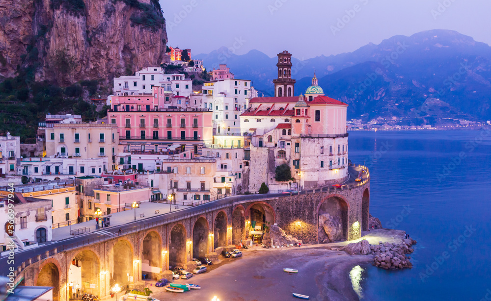Scenic view at Atrani town between mountains and sea at dusk, Amalfi coast.  It's a smallest municipality in Italy and is one of Italy’s undiscovered best-kept secrets. 