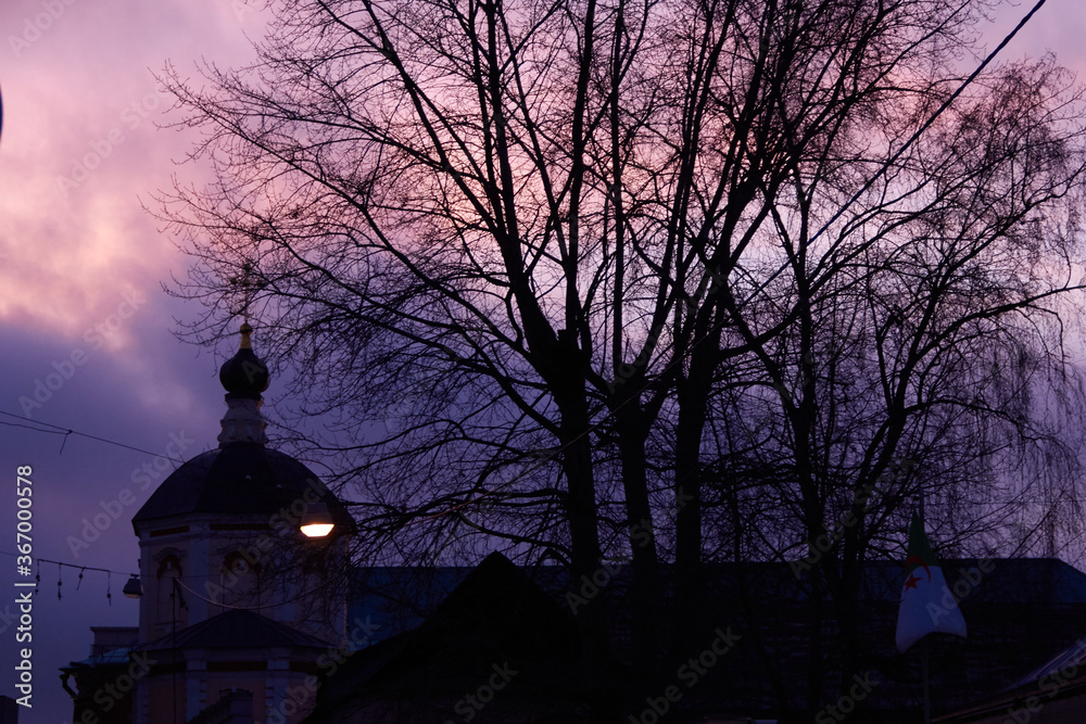 The resurrection monastery against the background of a harsh and magical purple sky