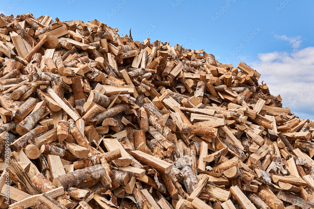 huge pile of firewood against the sky huge pile of firewood against the sky