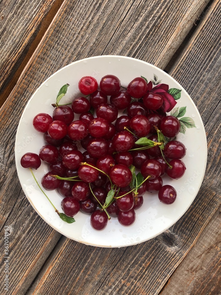 Ripe cherries in a white plate macro Ripe cherries in a white plate macro