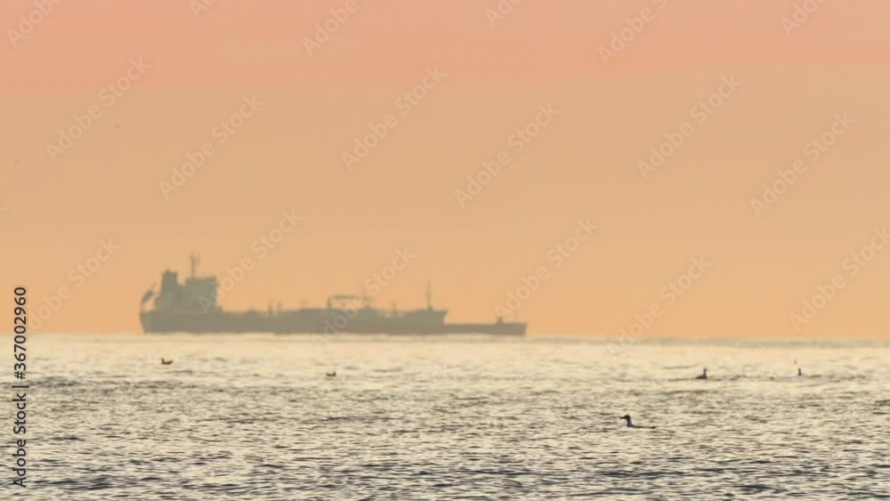 Sea sunrise and sailing cargo ship with containers Sea sunrise and sailing cargo ship with containers