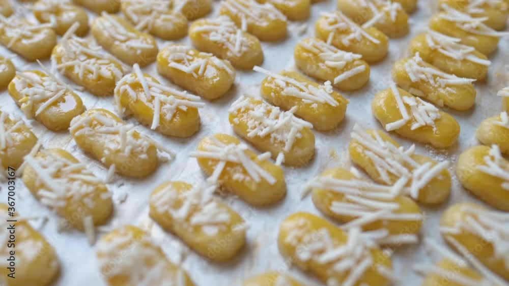 kaasstengels cake. close up of bakery making. cheese cookies kaasstengels cake. close up of bakery making. cheese cookies