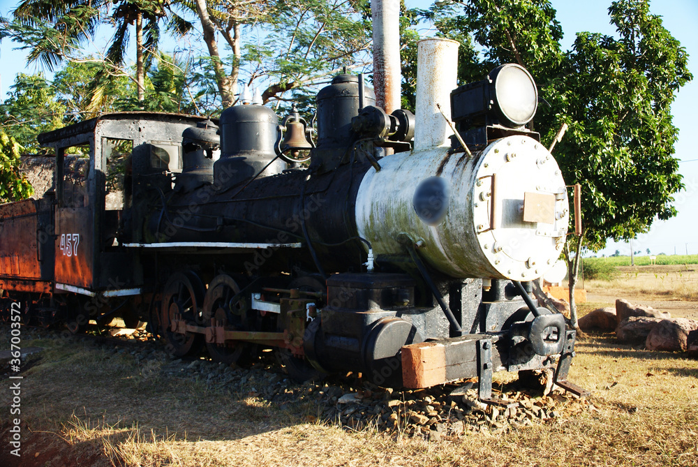 Naklejka premium an old black steam locomotive that was used on sugar plantations
