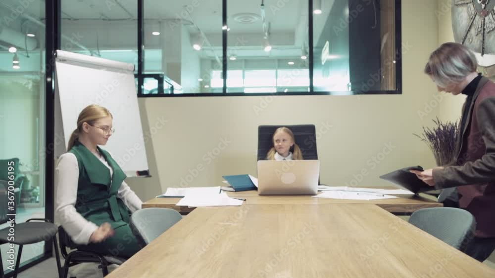 The concept of an affable kind good boss. Workers come in and sit down. The concept of an affable kind good boss. Workers come in and sit down.
