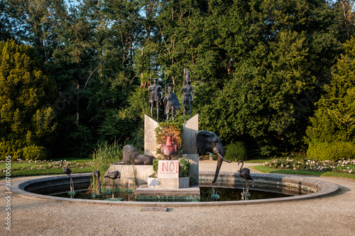 Public statue of King Leopold II vandalized with red paint.