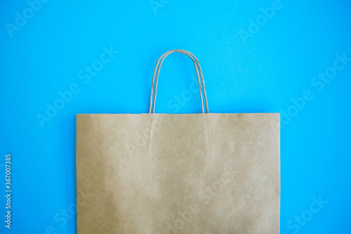 Paper bag on blue background