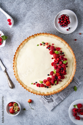 Large round shortcrust pastry pie with red berries