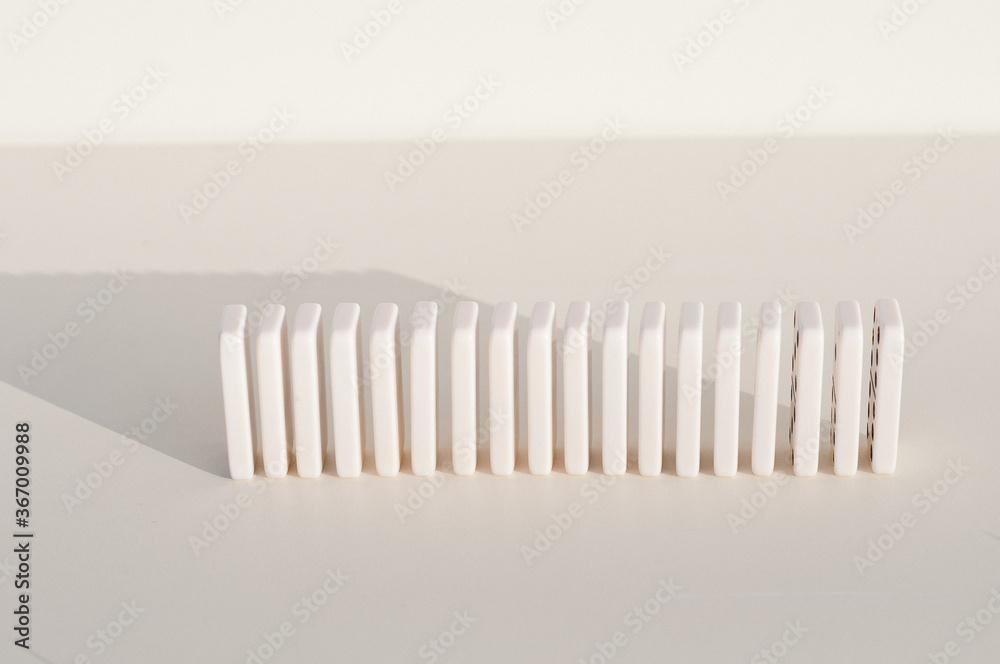 Block construction concept. figures of dominoes on a light background Block construction concept. figures of dominoes on a light background