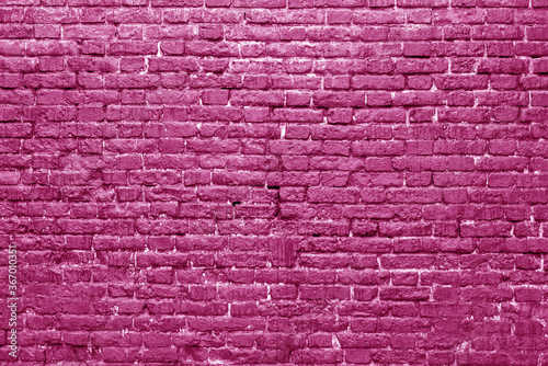 Pink brick wall. Loft interior design. Pink paint of the facade. Architectural background.