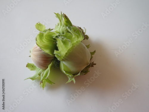 green hazelnut on a white table