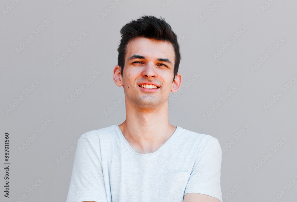 Good looking man, portrait on grey background Good looking man, portrait on grey background