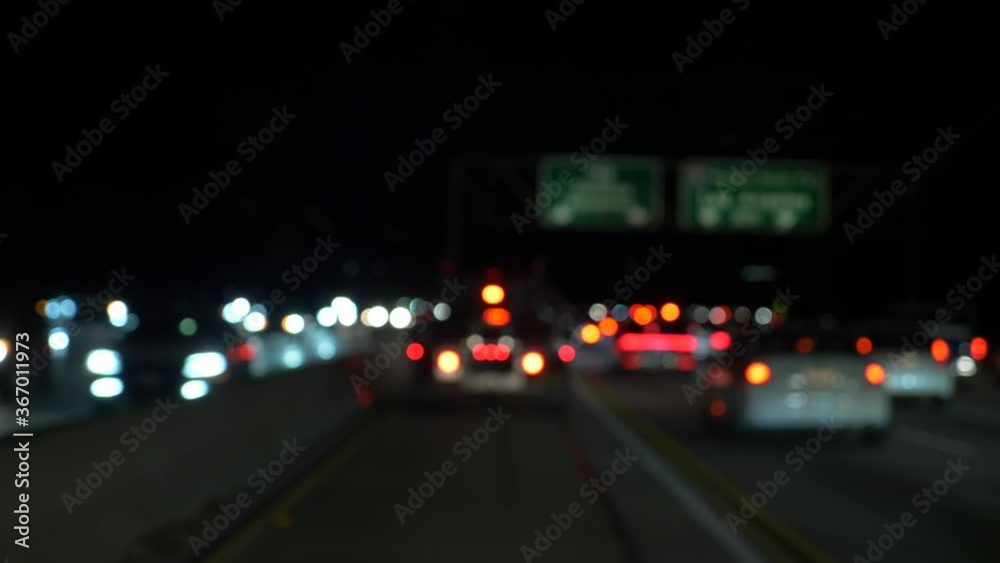 Blur bokeh Night traffic a lot of cars driving slowly with lights on Blur bokeh Night traffic a lot of cars driving slowly with lights on