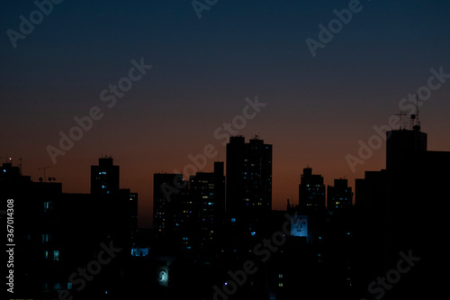 Recife   Pernambuco   Brazil. July  23.2020. Views of the buildings of Recife and the sky with new moon at dusk during quarantine of COVID-19.