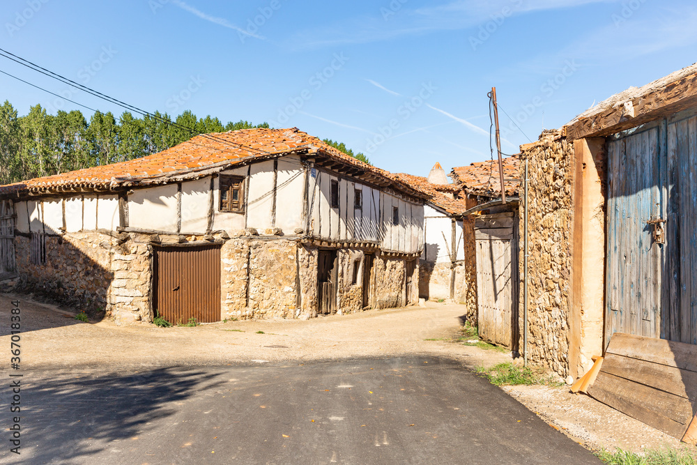a street in Retuerta village with typical old houses, province of Burgos, Castile and Leon, Spain