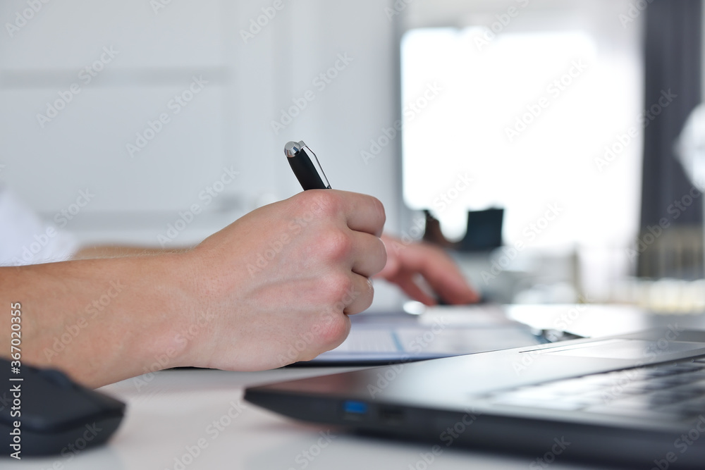 Financial auditor drawing stock report on paper Financial auditor drawing stock report on paper