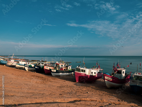 At Beach of Jaroslawiec in Poland fishing boats lie on the beach of the Baltic Sea