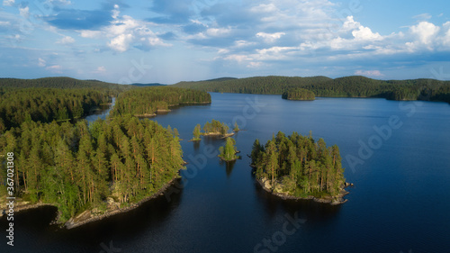 Aerial landscape of northern nature. lovely view of the island at sunset. Isojarvi lake. Summer landscape. National Park, Finalnd.  © raland