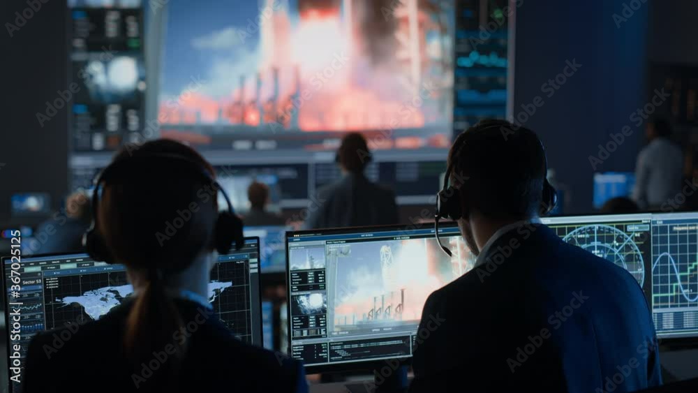 Flight Director Counts Down the Seconds Before Space Rocket Launch. Team in Mission Control Witness Successful Lift Off. Flight Control Employees Sit in Front of Computers and Monitor the Mission. Flight Director Counts Down the Seconds Before Space Rocket Launch. Team in Mission Control Witness Successful Lift Off. Flight Control Employees Sit in Front of Computers and Monitor the Mission.