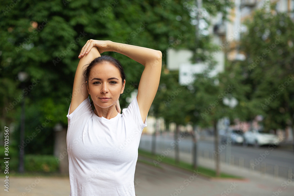 Sporty woman doing hands stretching