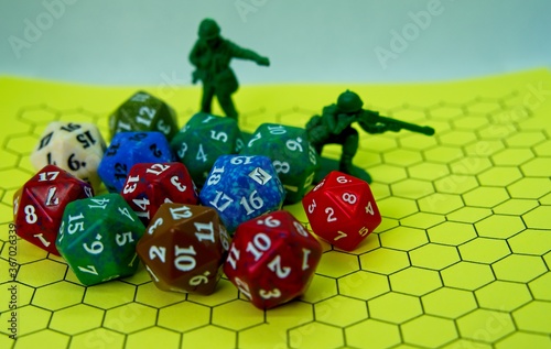 Role-playing board with several colored dice and plastic figures