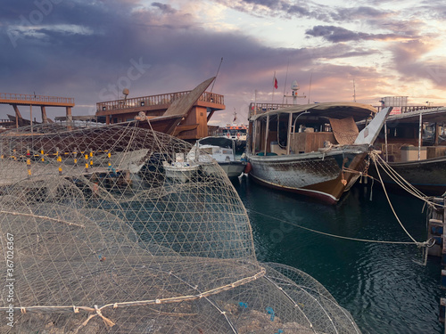 Dhow boat on wakra port at sunset time photo