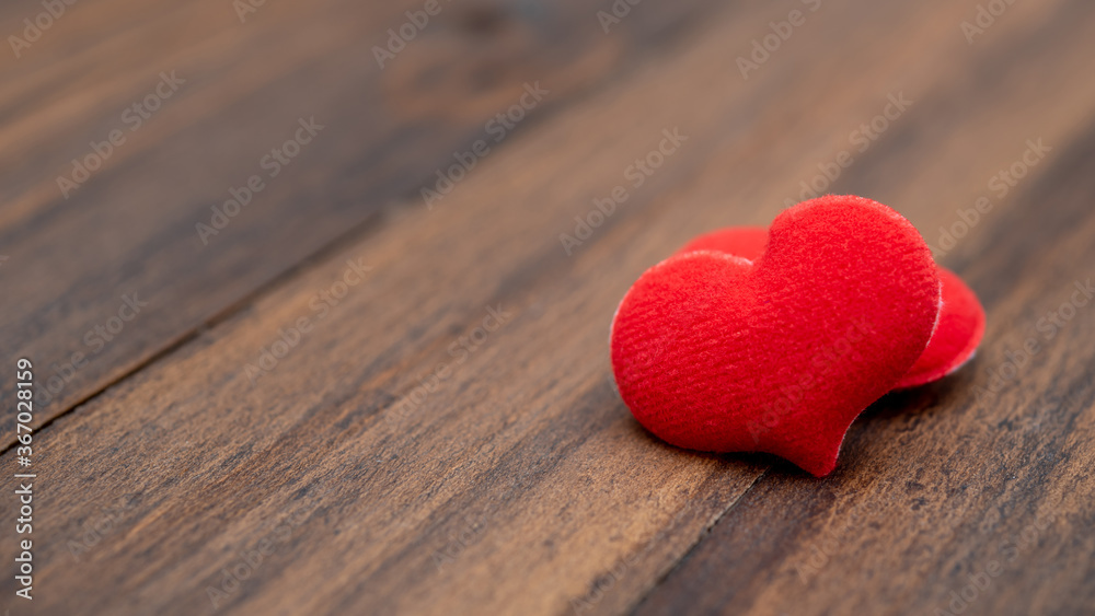 red heart shape on wood background red heart shape on wood background