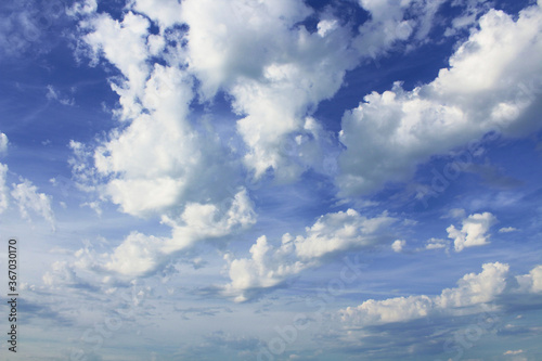 Beautiful blue sky and white large cumulus clouds. Background. Landscape.